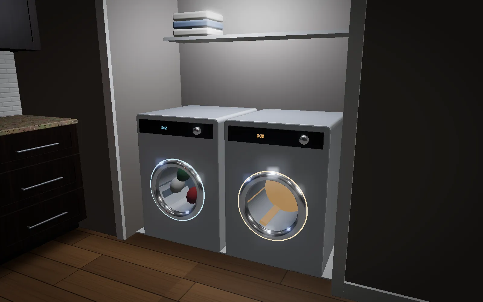 A front-load washer and dryer in a laundry alcove off the kitchen, both lit and running